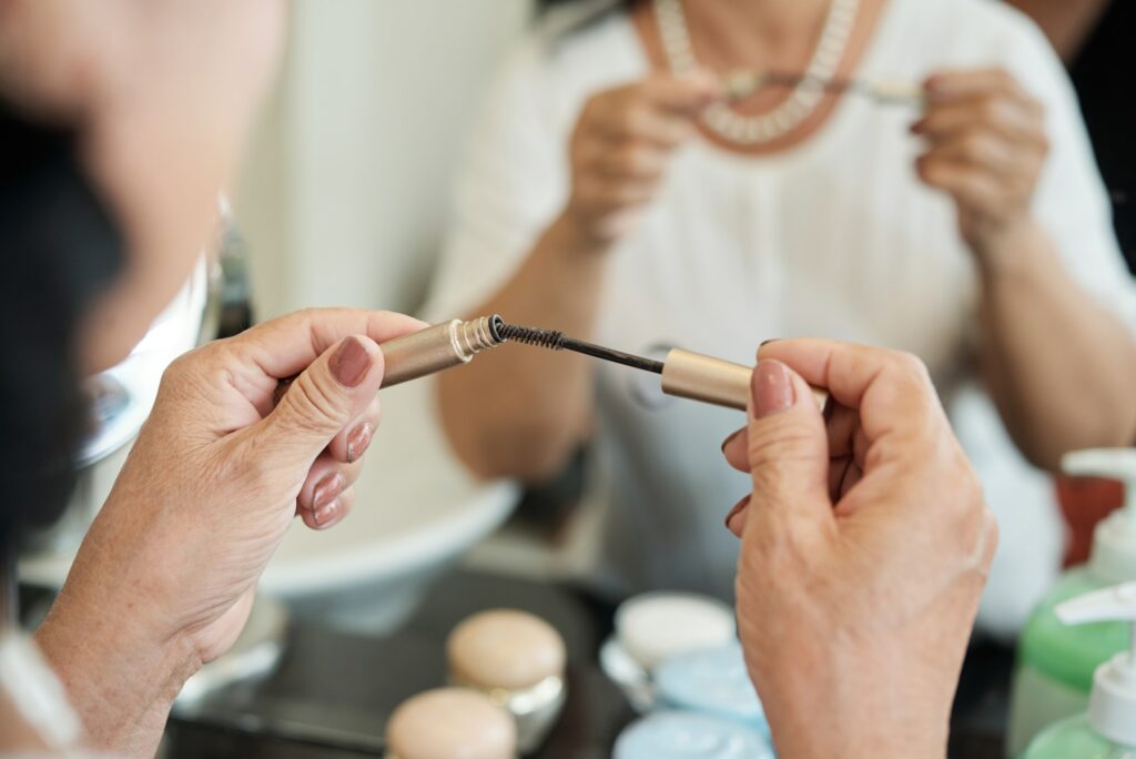 Elderly Woman Holding Mascara