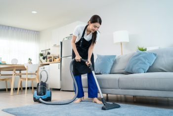 Asian cleaning service woman worker cleaning in living room at home. Asian cleaning service woman worker cleaning in living room at home.